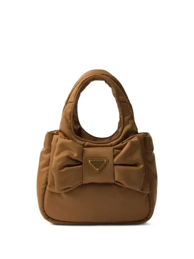 Prada Padded Re-nylon Mini-bag With Bow In Brown
