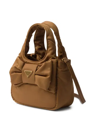 Prada Padded Re-nylon Mini-bag With Bow In Brown
