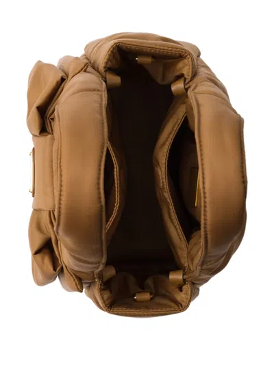 Prada Padded Re-nylon Mini-bag With Bow In Brown