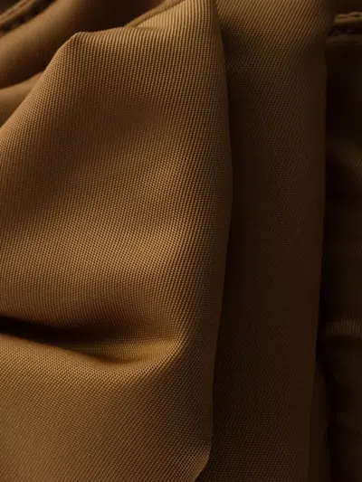 Prada Padded Re-nylon Mini-bag With Bow In Brown