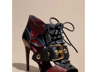 Shop Burberry Buckle Detail Leather And Snakeskin Cut-out Ankle Boots In Bordeaux