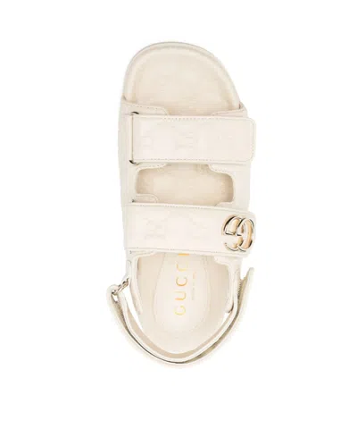 Gucci Gg Embossed Strap Sandals In Neutral
