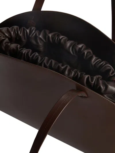 Jil Sander 'curve Medium' Brown Shoulder Bag With Embossed Logo On The Front And Curved Design