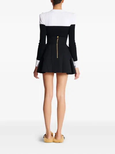 Balmain Button-embellished Pleated Grain De Poudre Wool Mini Skirt In Black