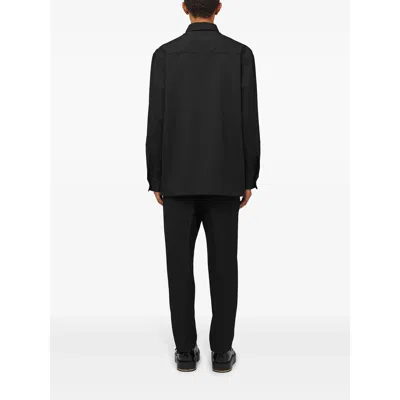Jil Sander Wool Logo Cuffed Trousers In Black