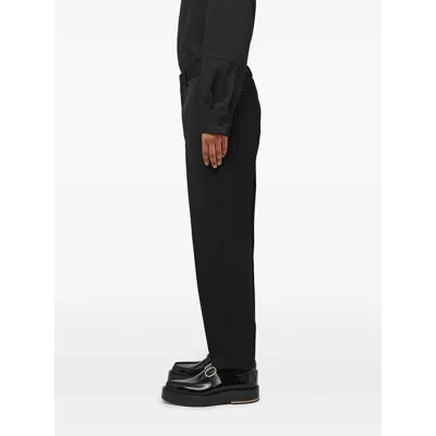 Jil Sander Wool Logo Cuffed Trousers In Black