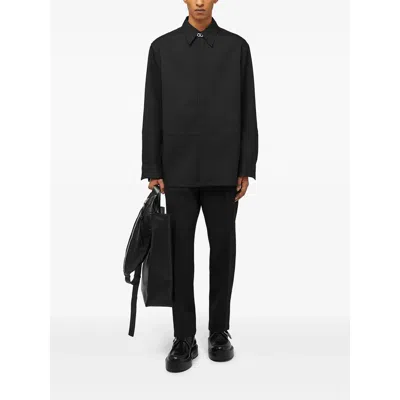 Jil Sander Wool Logo Cuffed Trousers In Black