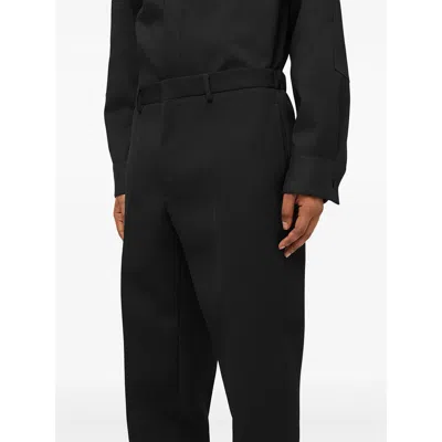 Jil Sander Wool Logo Cuffed Trousers In Black