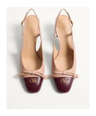 Valentino Garavani Valet Du Roi Tasseled Bow-embellished Two-tone Leather Pumps In Neutral