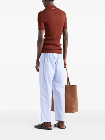 Prada Ribbed Knit Cotton Polo Shirt In Brown