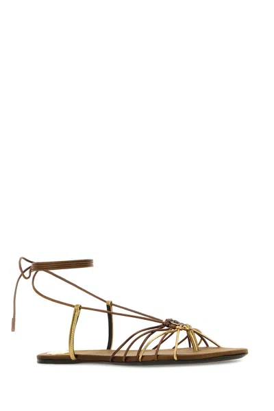 Saint Laurent Cassandre Leather Flat Strappy Sandals In Gold