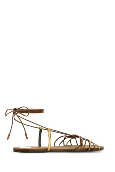 Saint Laurent Cassandre Leather Flat Strappy Sandals In Gold