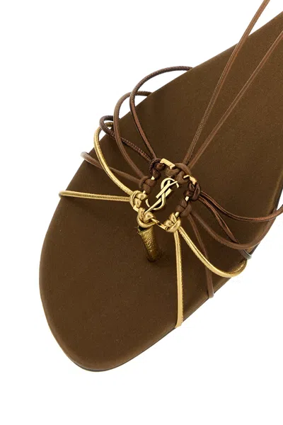 Saint Laurent Cassandre Leather Flat Strappy Sandals In Gold