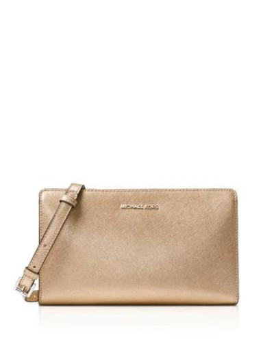 Shop Michael Michael Kors Jet Set Travel Large Metallic Crossbody In Pale Gold