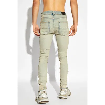 Amiri Mx1 Slim Fit Jeans With Distressed Red Accents