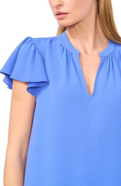 Cece Split Neck Flutter Sleeve Top In Blue