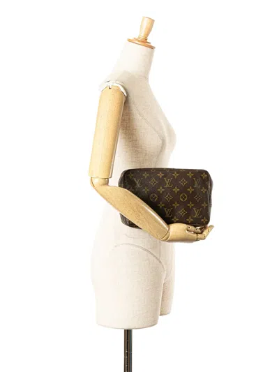 Pre-owned Louis Vuitton 1983 Monogram Trousse Toilette 23 Clutch Bag In Brown
