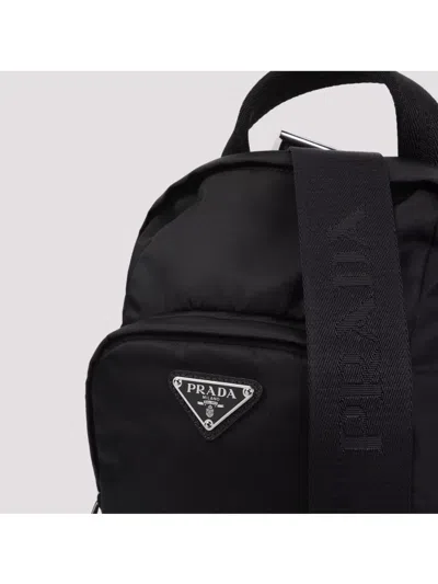 Prada Logo Re-nylon And Saffiano Leather Backpack In Black