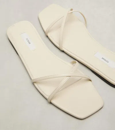 Totême Leather Crossover Slides Off-white