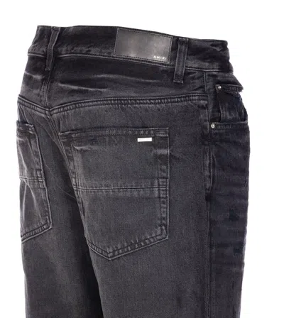Amiri Distressed Denim Trousers With Faded Detailing