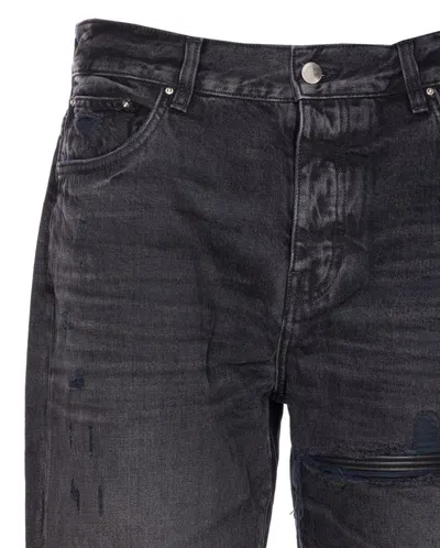Amiri Distressed Denim Trousers With Faded Detailing