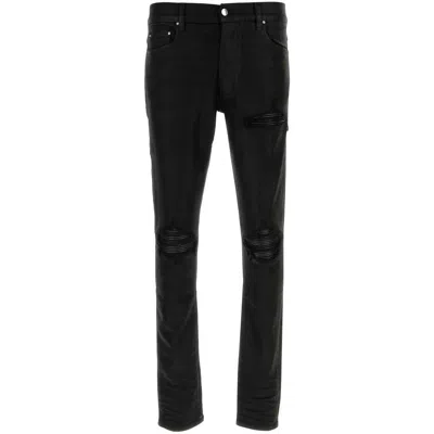 Amiri Slim Fit Distressed Trousers With Rivet Detailing In Black