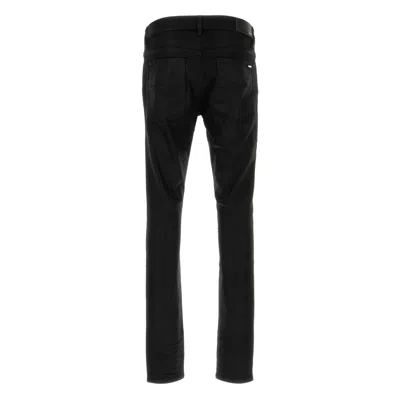 Amiri Slim Fit Distressed Trousers With Rivet Detailing In Black