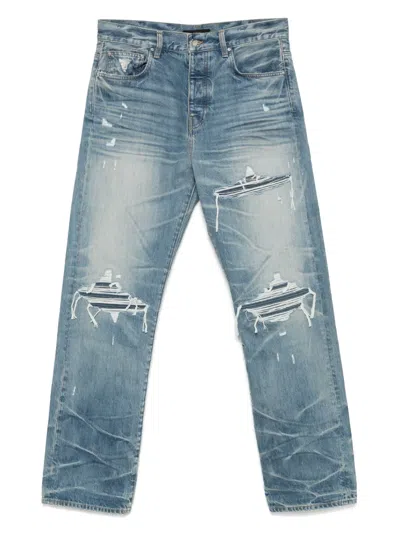 Amiri Men Blue Jeans With Ripped Details On The Front And Logo Patch On The Rear In Denim Man