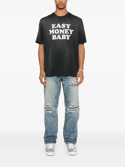 Amiri Men Blue Jeans With Ripped Details On The Front And Logo Patch On The Rear In Denim Man