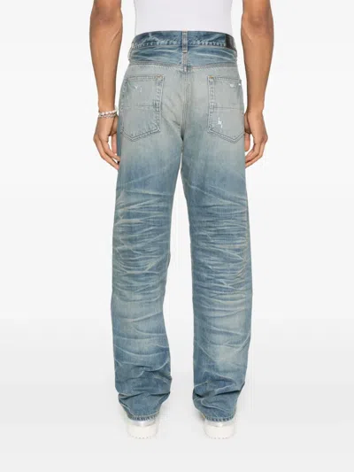 Amiri Men Blue Jeans With Ripped Details On The Front And Logo Patch On The Rear In Denim Man