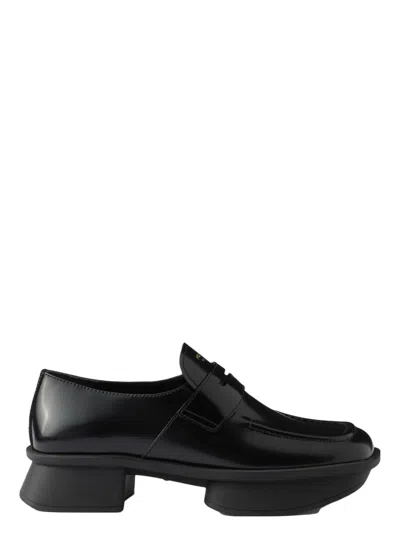Prada Re-edition Equal Platform Penny Loafer In Black