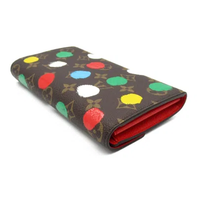 Pre-owned Louis Vuitton Brown Coated Canvas Monogram Pvc Long Wallet (bi-fold) ()
