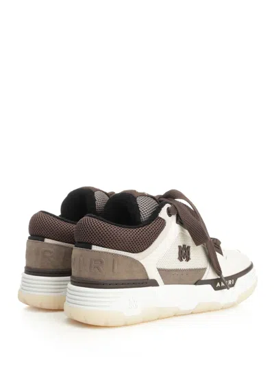 Amiri Brown Low Top Sneakers With Logo Detail On The Side And Mesh Panels In Brown