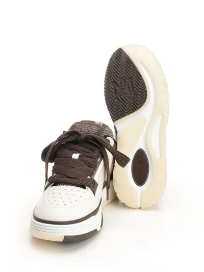 Amiri Brown Low Top Sneakers With Logo Detail On The Side And Mesh Panels In Brown