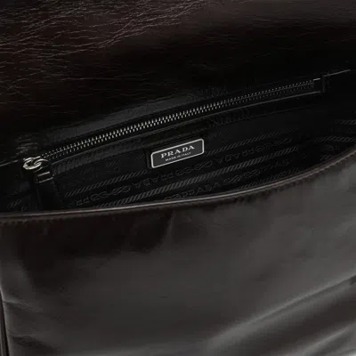 Prada Triangle Logo Leather Messenger Bag In Brown