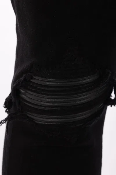 Amiri Slim Fit Distressed Trousers With Rivet Detailing