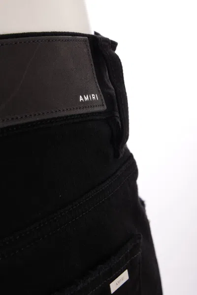 Amiri Slim Fit Distressed Trousers With Rivet Detailing