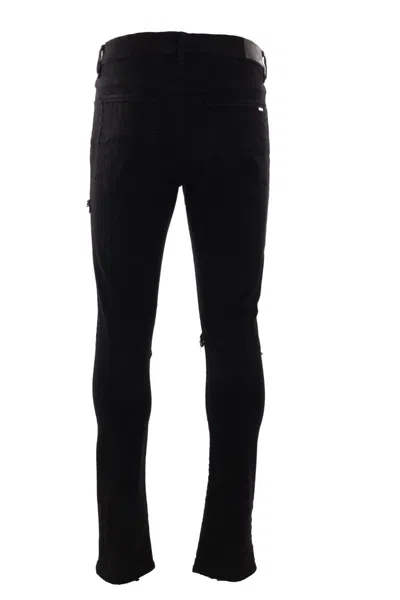 Amiri Slim Fit Distressed Trousers With Rivet Detailing