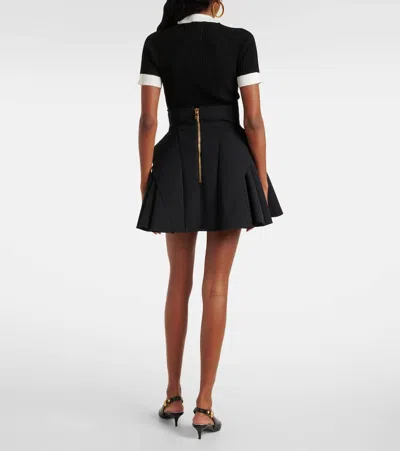 Balmain Button-embellished Pleated Grain De Poudre Wool Mini Skirt In Black