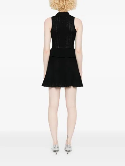 Self-portrait Pointelle-knit Mini Dress With Flap Pockets And Chain-link Accents In Black