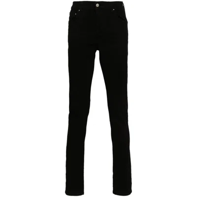 Amiri Slim Fit Distressed Trousers With Rivet Detailing