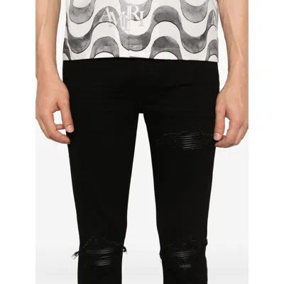 Amiri Slim Fit Distressed Trousers With Rivet Detailing