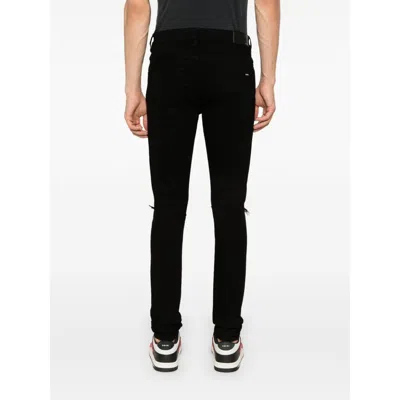 Amiri Slim Fit Distressed Trousers With Rivet Detailing
