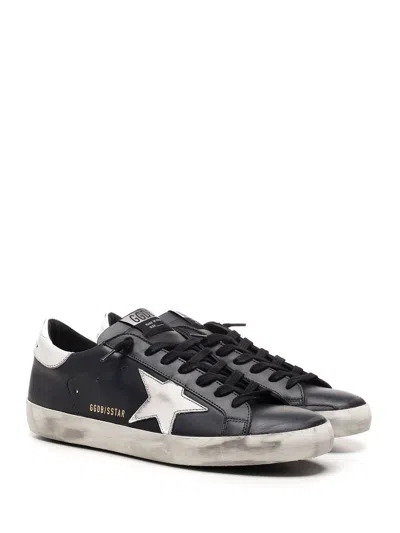 Golden Goose 'super-star' Black Low Top Sneakers With Logo Patch And Suede Details In Leather Man