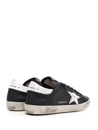 Golden Goose 'super-star' Black Low Top Sneakers With Logo Patch And Suede Details In Leather Man