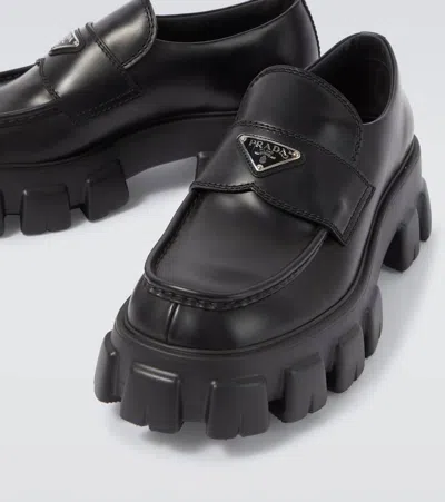 Prada Tread Sole Triangular Logo Plaque Leather Penny Loafers In Black
