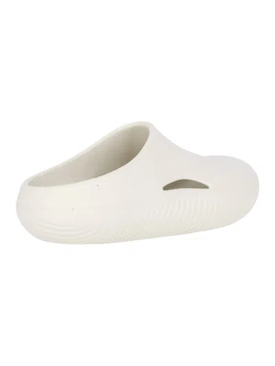 Crocs Logo-embossed Round-toe Slides In Neutral