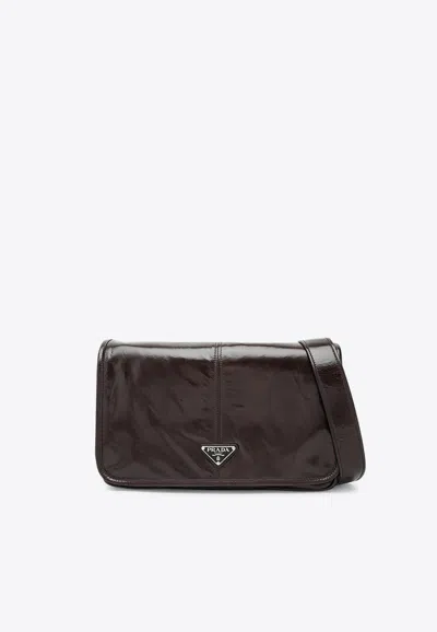 Prada Triangle Logo Leather Messenger Bag In Brown