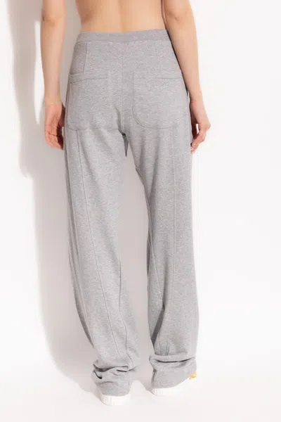 Versace Debossed Logo Twisted Track Pants In Gray