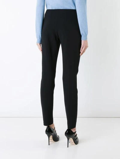 Shop Moschino Slim Fit Trousers In Black